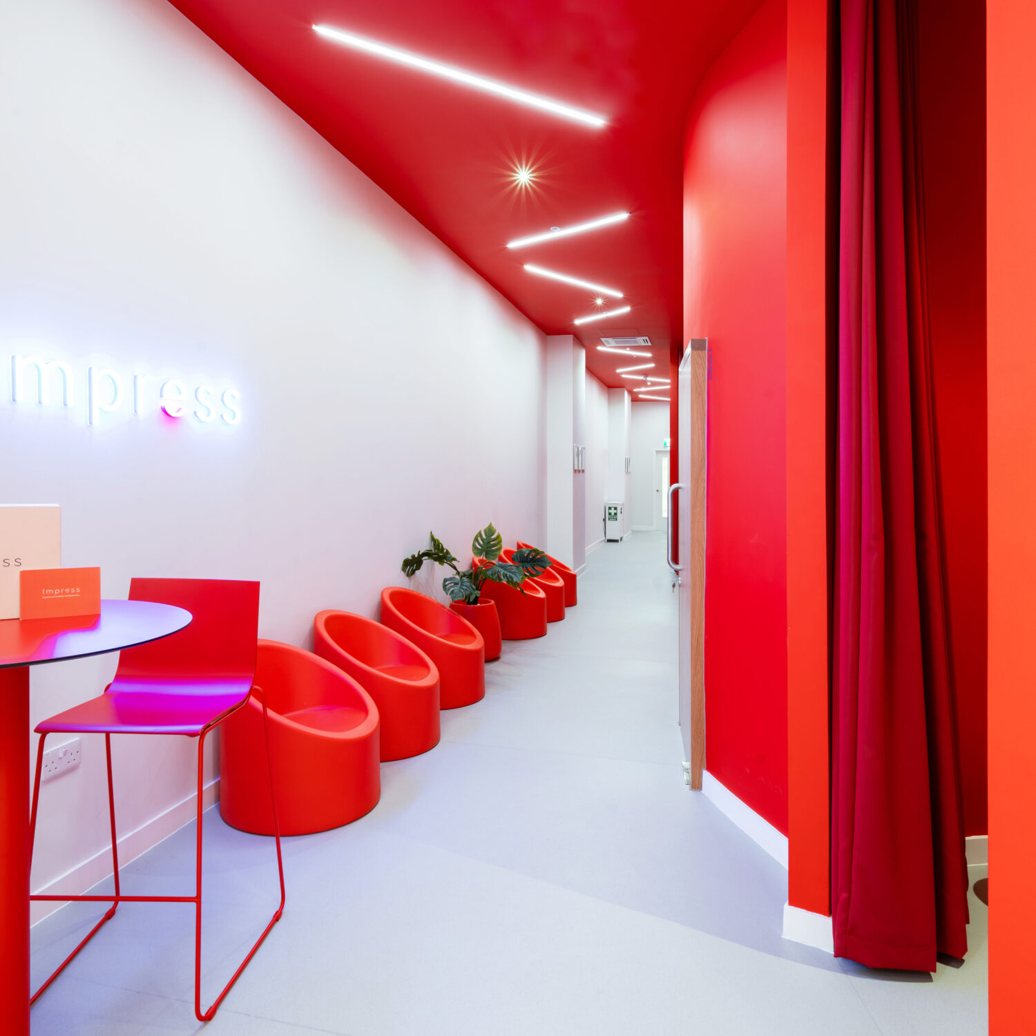 corridor with bright red seating