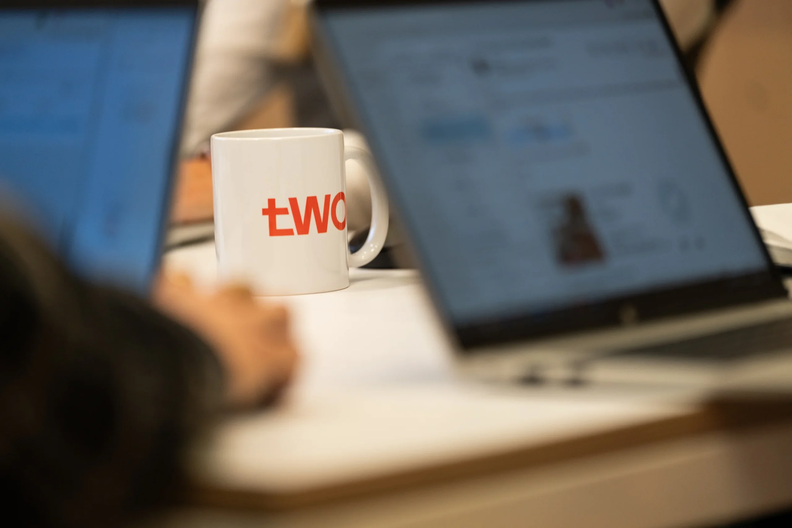 Seating area at Two featuring a branded mug