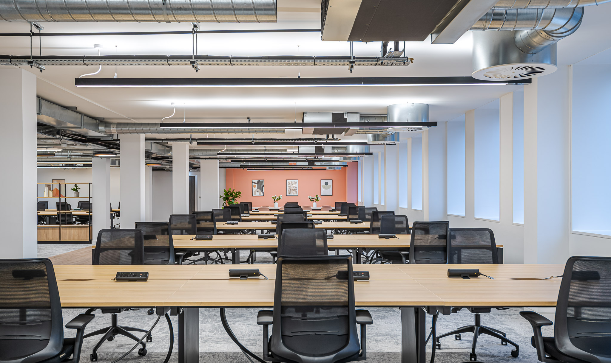 Asset Management Firm open-plan workspace, with an exposed ceiling