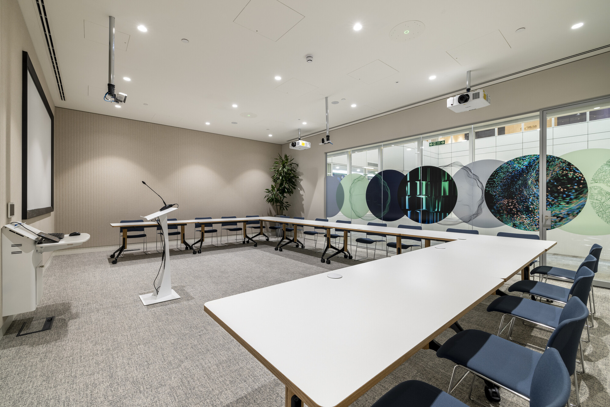 The training room at CMC Markets, designed by Two, is equipped with modern presentation technology and flexible seating arrangements.