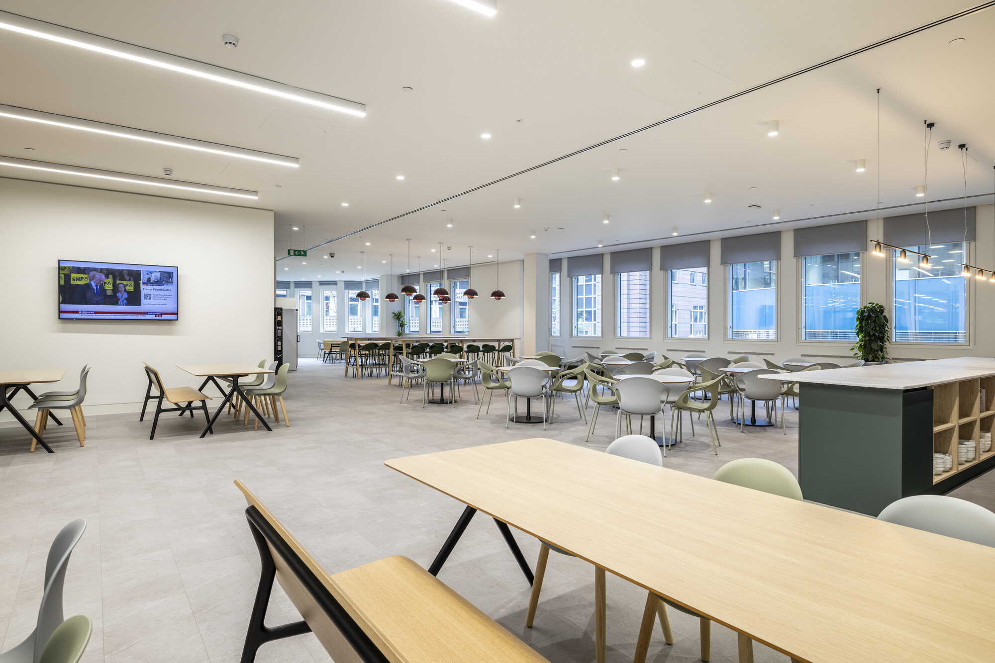 Spacious dining area at CMC Markets designed by Two, featuring modern furnishings, natural light, and flexible seating arrangements.