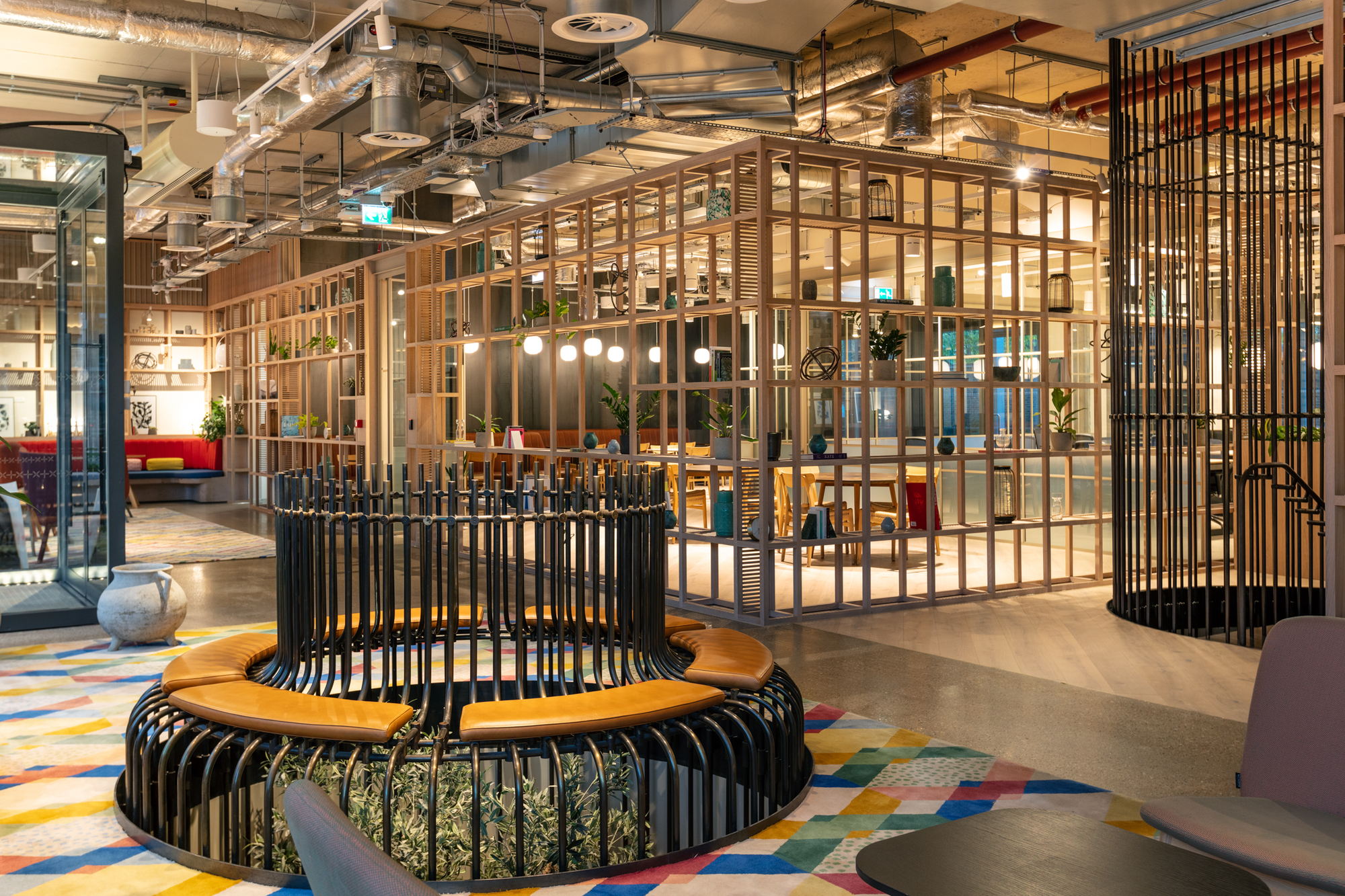 Collaborative office seating area designed by Two for FORA Borough Market, showcasing modern industrial aesthetics and vibrant shared spaces.