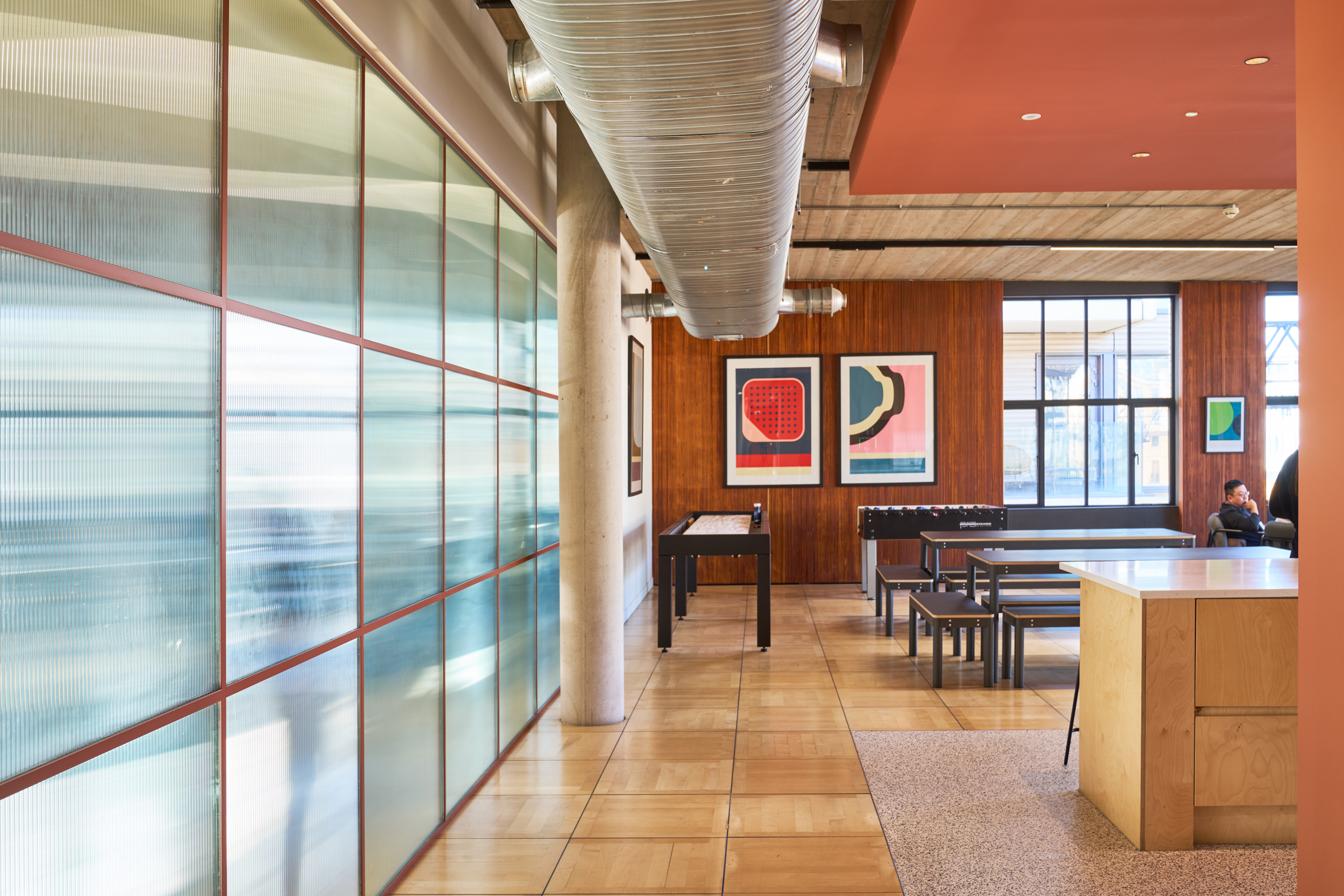 Recreation space in the Joseph Joseph office, featuring game tables, bold artwork, and a blend of functional and playful design elements.