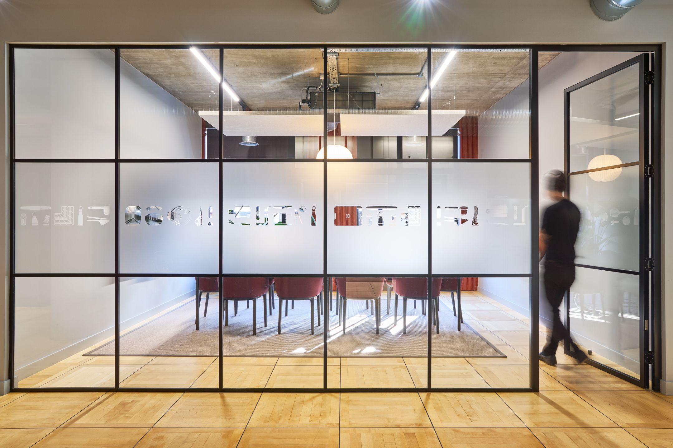 Bespoke manifestation on the glass walls of a meeting room at the Joseph Joseph office, designed by Two, blending transparency with privacy.