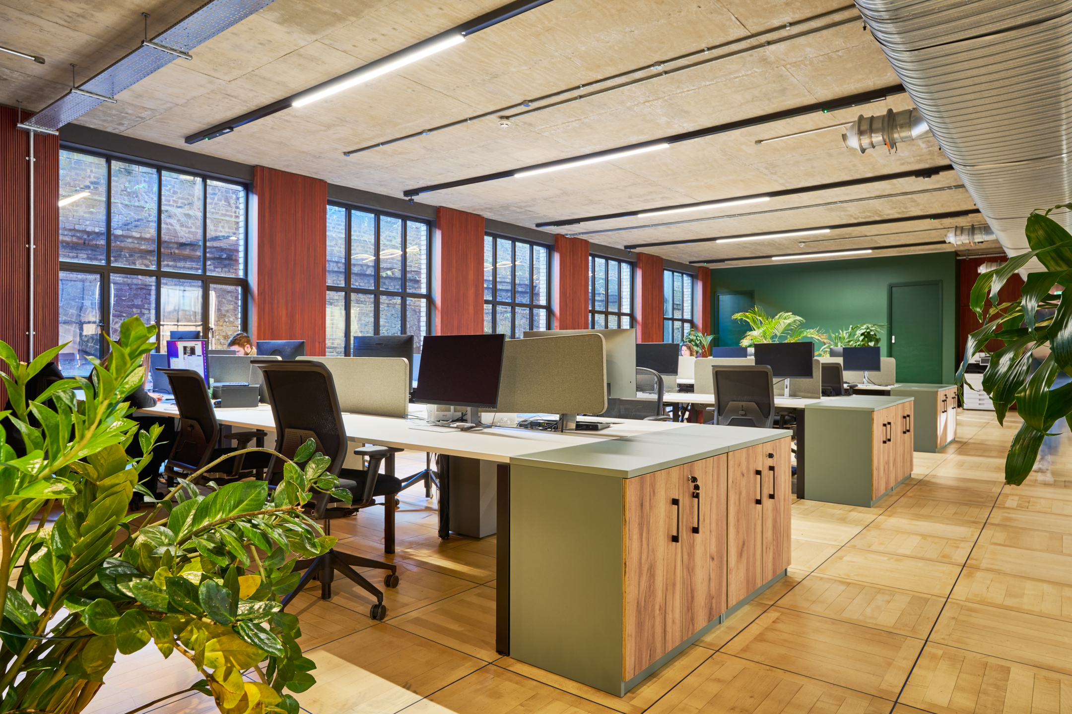 The open-plan workspace Joseph Joseph’s offices, designed by Two, featuring modern desks, ergonomic chairs, and natural greenery for a collaborative environment.