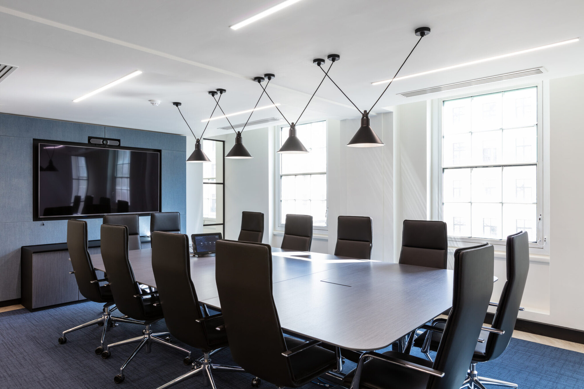 Meeting room designed for Literacy Capital's first HQ, incorporating sleek furniture and neutral tones to suit their professional needs.