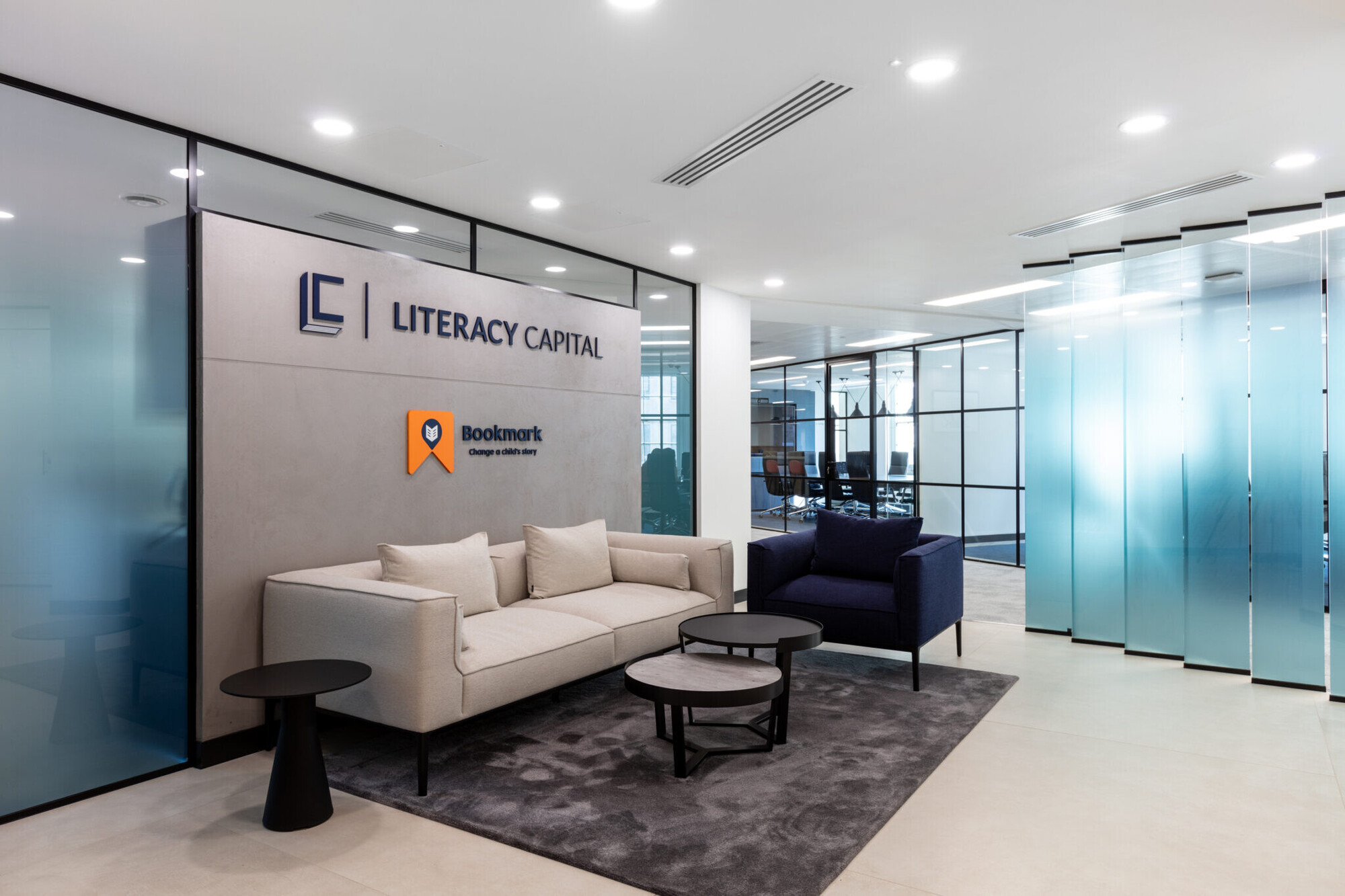 Literacy Capital's reception area with branding for both Literacy Capital and Bookmark, showcasing their shared HQ.