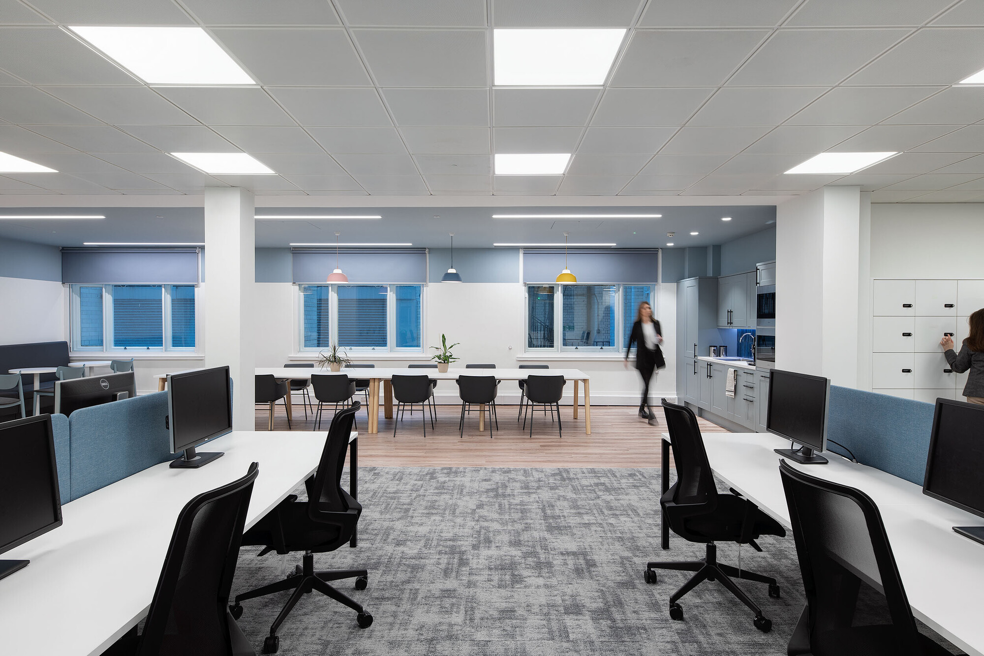 Open desks and seating area at Socotec with white walls