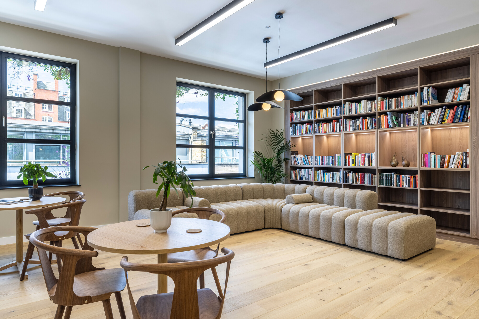 Transition's London workspace by Two, featuring bespoke shelving and Scandinavian-inspired furniture in a warm, eco-friendly lounge area