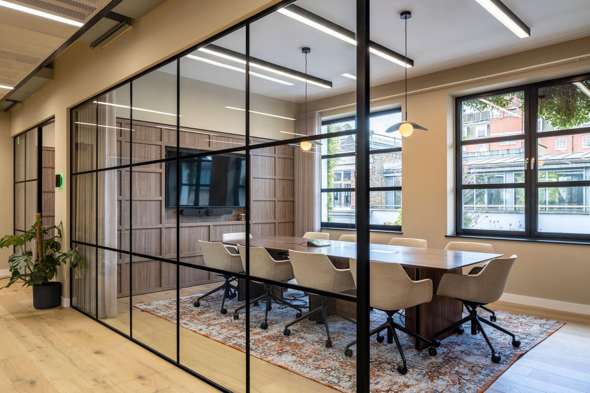 Transition's meeting room designed by Two, featuring glazing for natural light, sustainable timber accents, and eco-conscious materials.