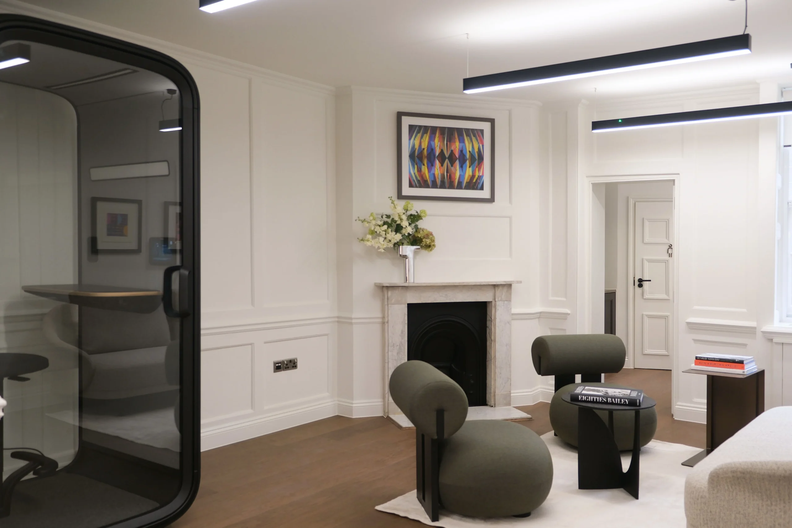 33 Mayfair phonebooth featuring bespoke seating, a black phonebooth.