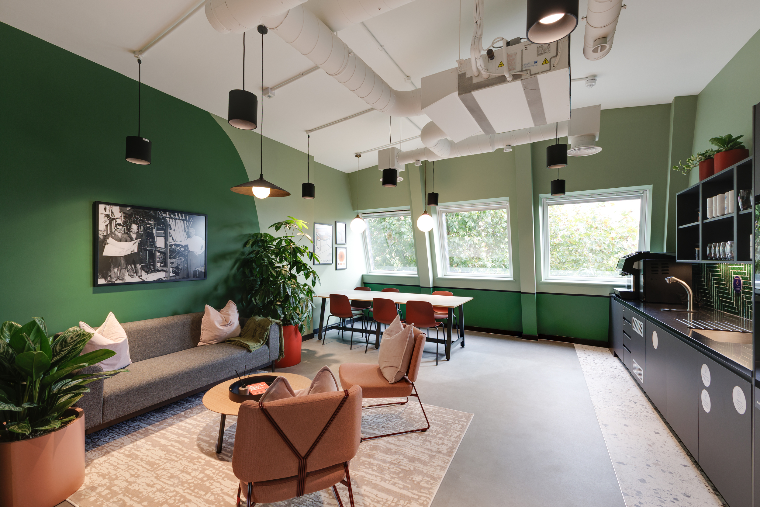 Lounge and teapoint area at Work.Life Clerkenwell Green with deep green walls, soft pink seating and large windows, completed by Two.