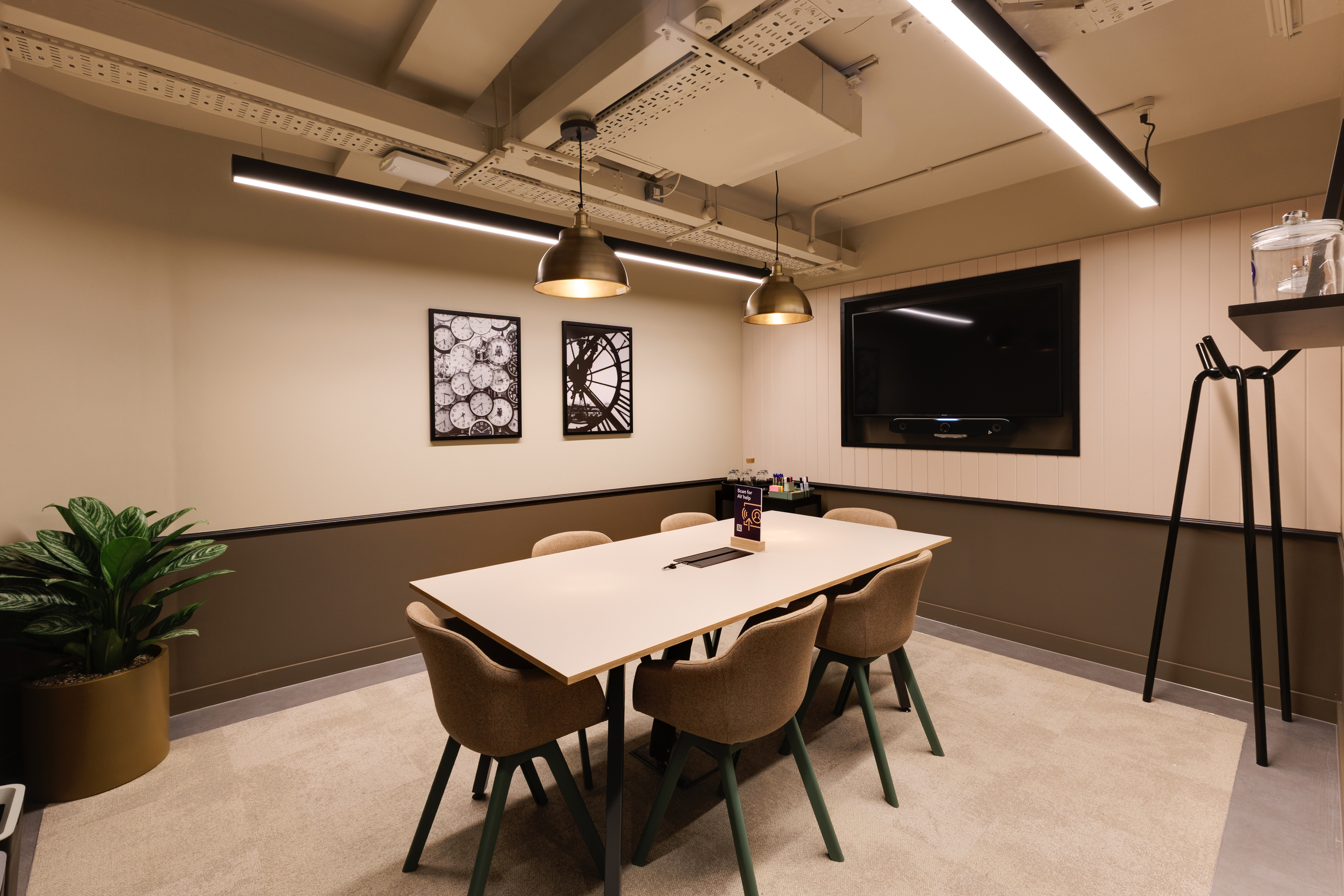 Meeting room at Work.Life Clerkenwell Green featuring a neutral colour palette, integrated screen and modern furnishings, completed by Two.
